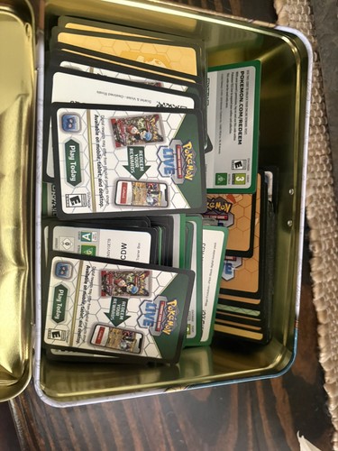 Tin pokemon trading card - of,